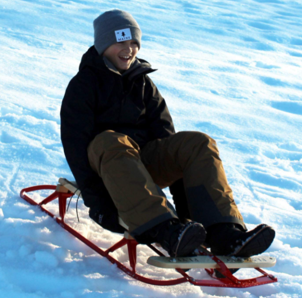 family fun snow sledding